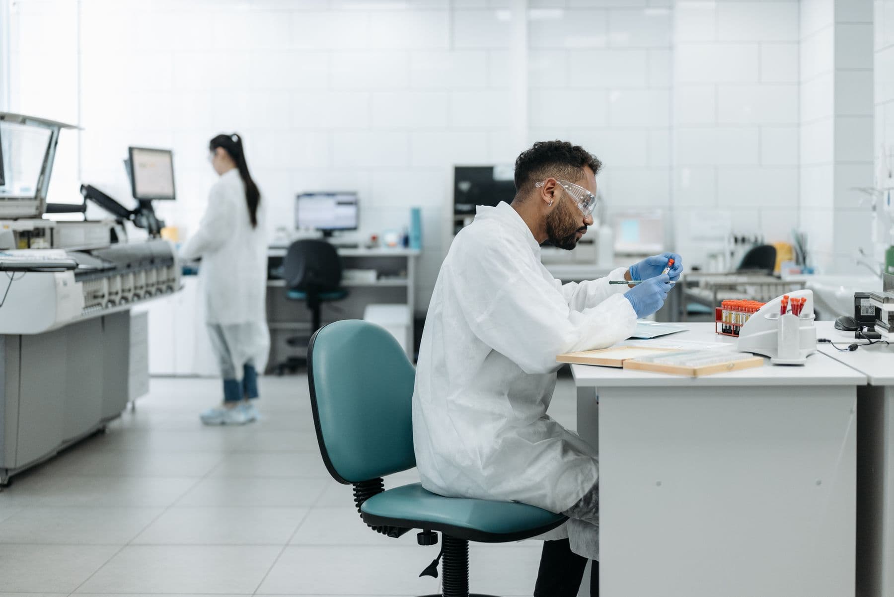 Researchers at work in a bright laboratory